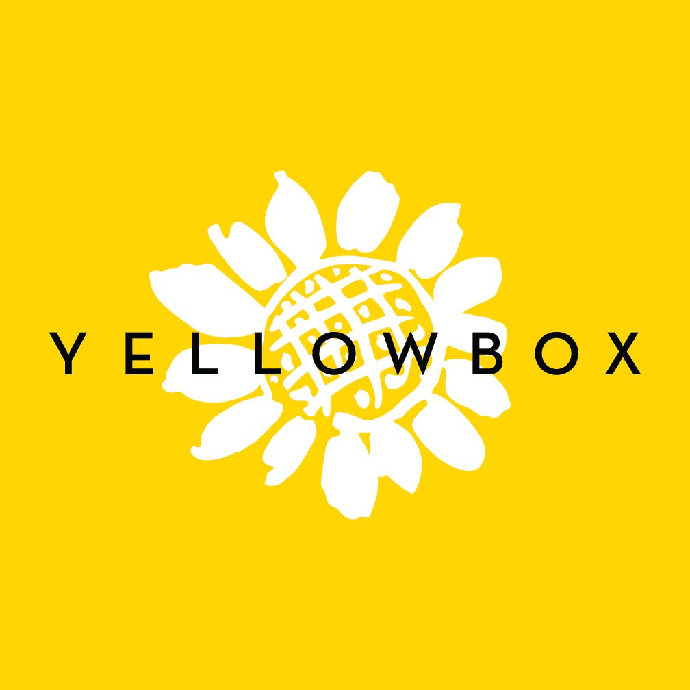 A yellow background with the words yellowbox in front of a white flower.